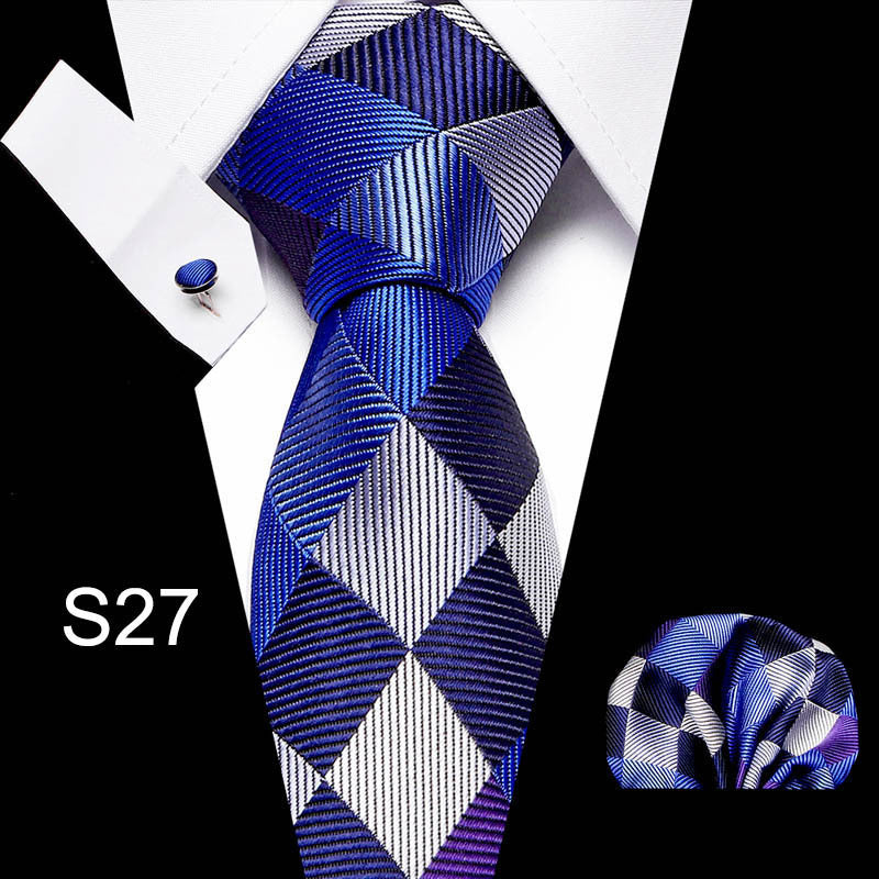 Blue and white patterned tie with matching pocket square on a black background