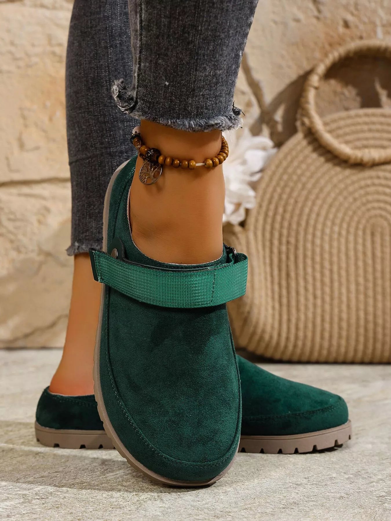 Green round-toe slip-on flats with side strap and contrast midsole