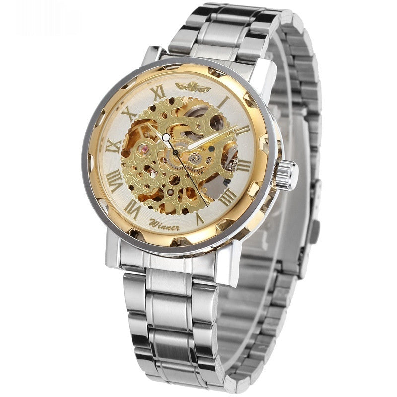 Silver and gold watch with transparent face on a white background
