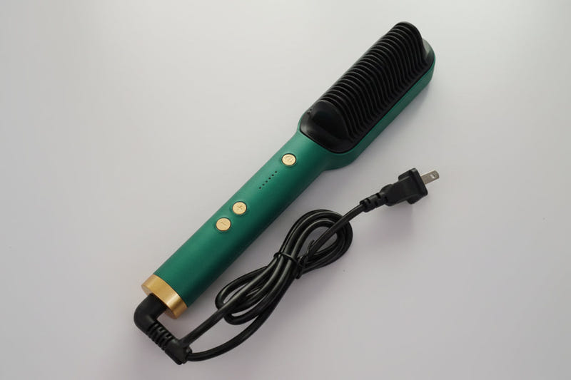 Green ionic hair straightening brush with black bristle head and power cord