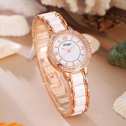 Rose gold round quartz wristwatch with white dial and white link bracelet
