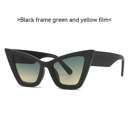Black frame sunglasses with green and yellow gradient lenses on a white background