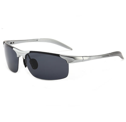 Sunglasses with silver frame and dark lenses on a white background