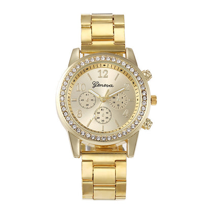 Gold wristwatch with gemstone accents on a white background