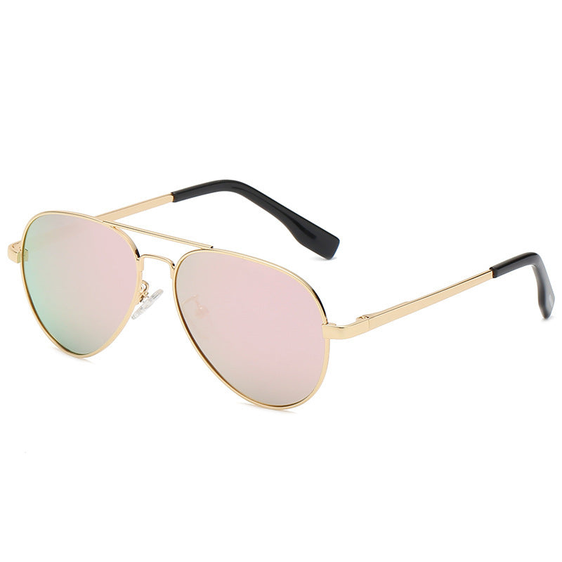 Gold-framed sunglasses with pink-tinted lenses on a white background