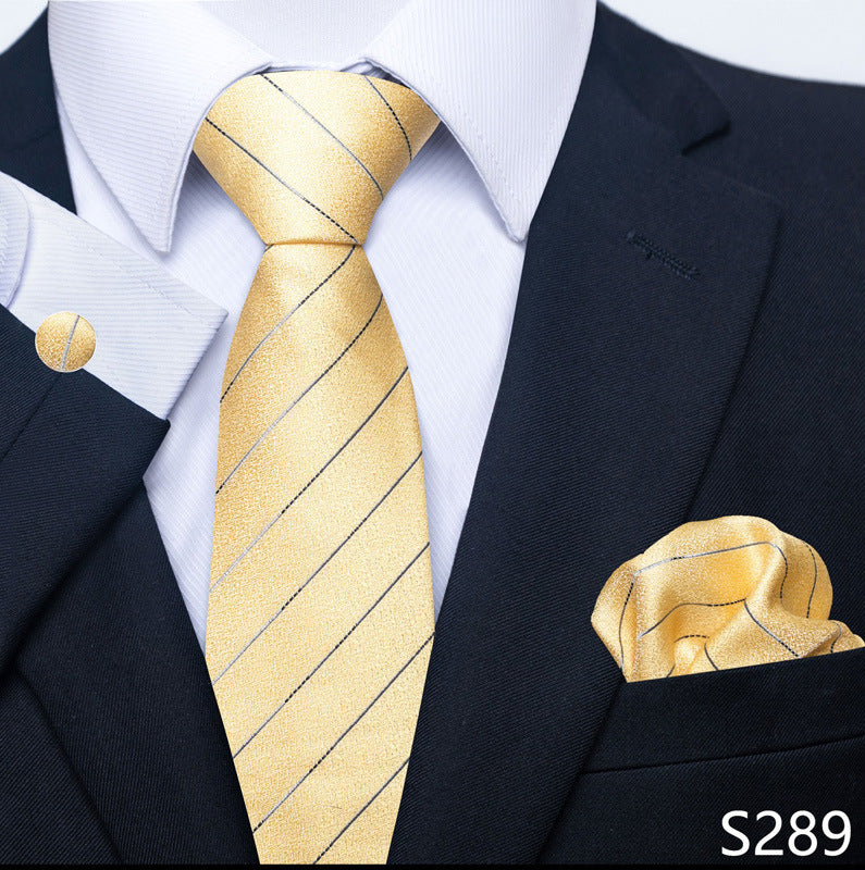 Gold striped tie and matching pocket square with a black suit and white shirt.