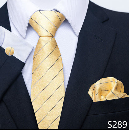 Gold striped tie and matching pocket square with a black suit and white shirt.