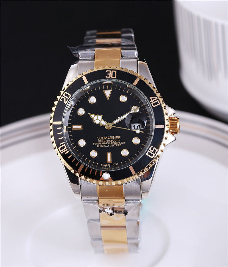 Steel wristwatch with dark dial, stainless bracelet, gold-toned bezel with minute markers.