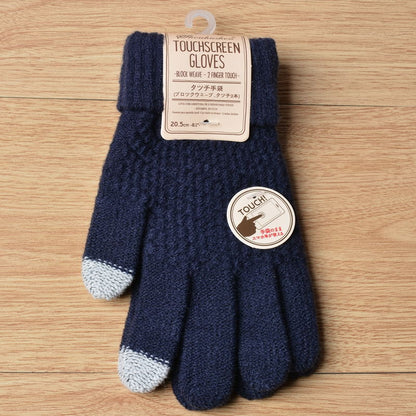 Pair of blue touchscreen gloves with a label on a wooden surface