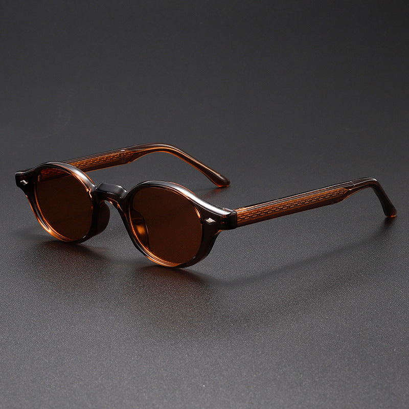 Brown sunglasses with wooden accents on a dark gray background