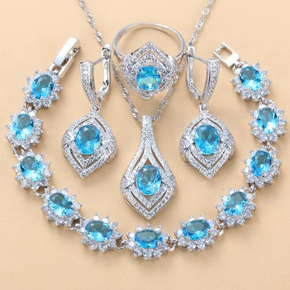 Jewelry set with blue gemstones on a beige background