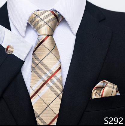 Beige plaid tie and matching pocket square with a black suit and white shirt.
