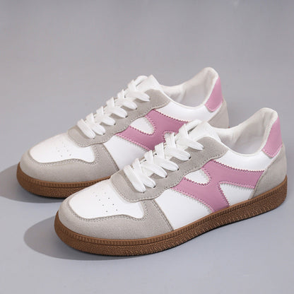 Women's low-top color-block sneakers, white with pink panels and tan gum outsole.