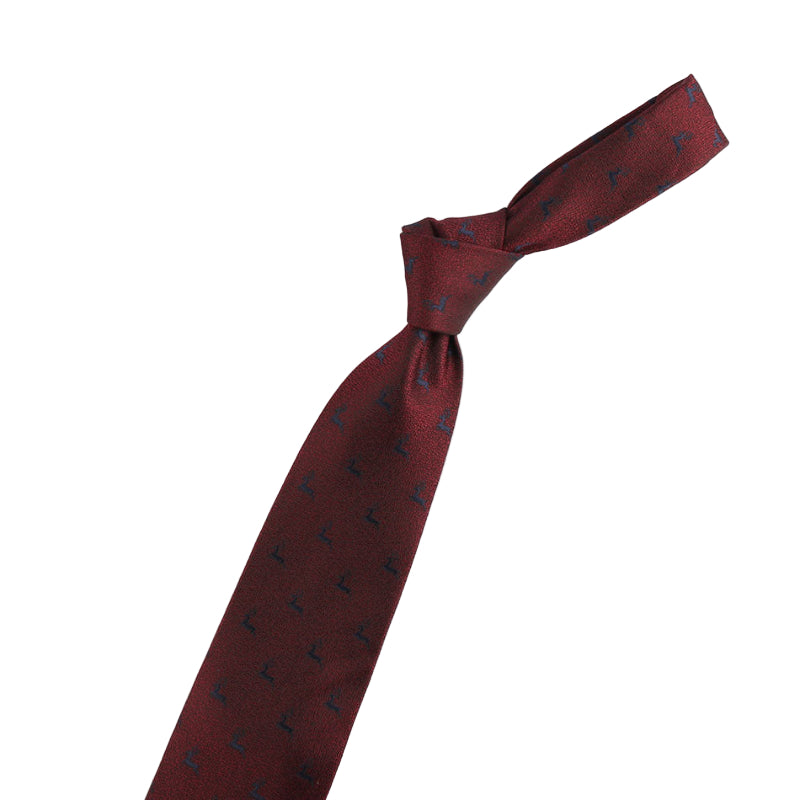 Maroon tie with black patterns and a gold violin-shaped accessory on a white background