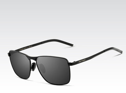 Black sunglasses with a visible brand logo on a light gray background