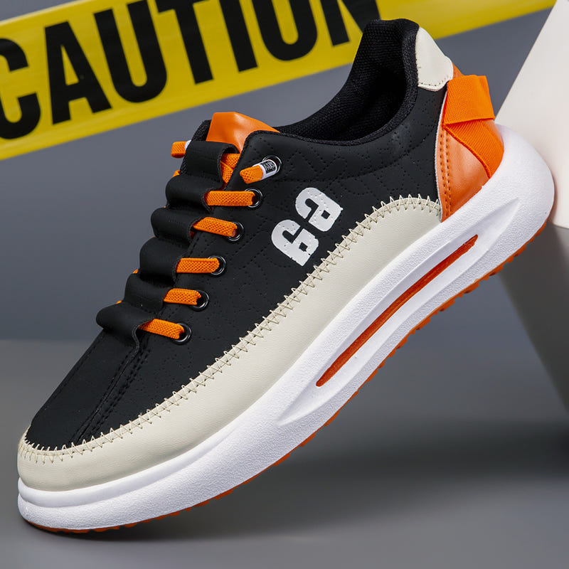 Men's black sneakers with orange laces and white side panel, thick white sole