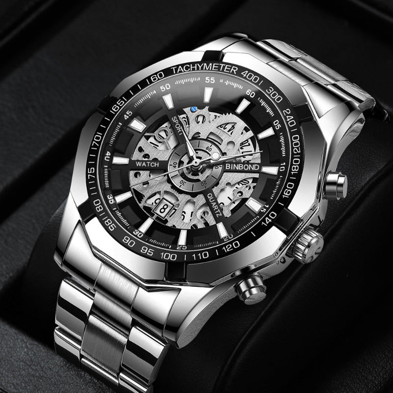 Silver wristwatch with a detailed face on a dark background