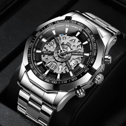 Silver wristwatch with a detailed face on a dark background