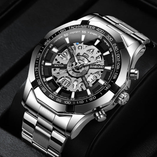 Silver wristwatch with a detailed face on a dark background