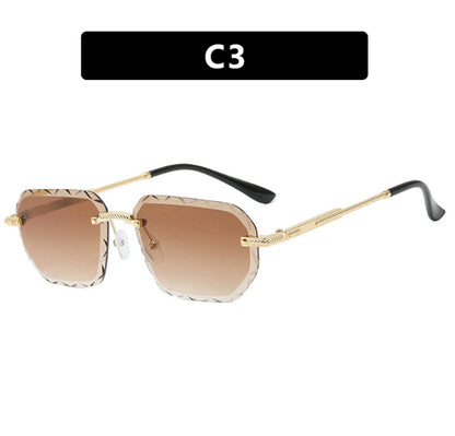 Sunglasses with gold frame and brown gradient lenses on a white background