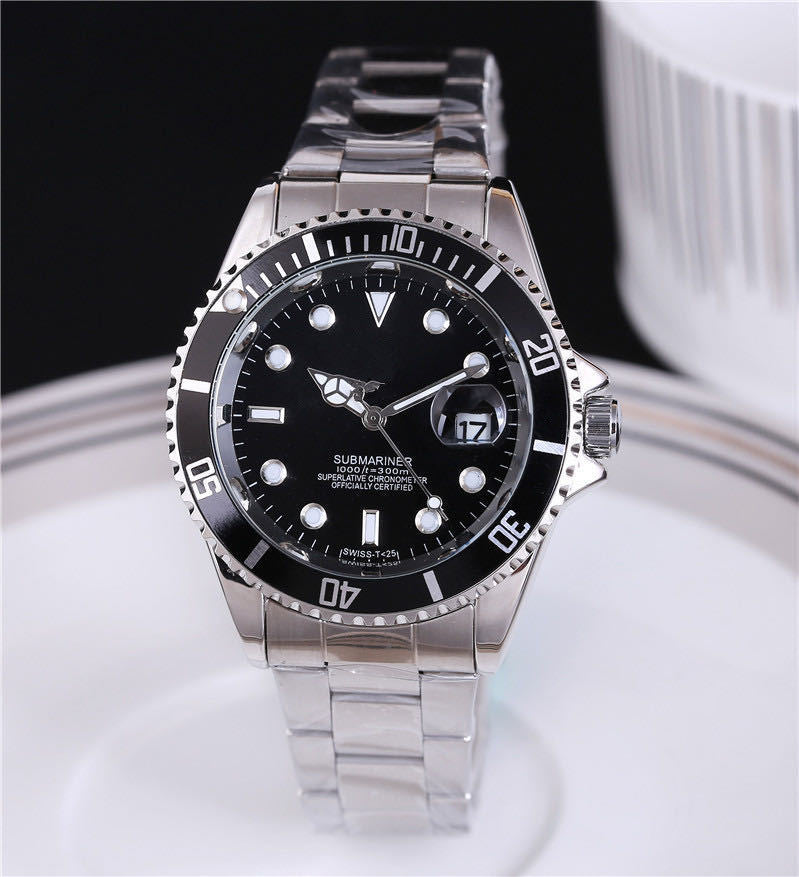 Steel wristwatch with black dial, stainless bracelet, black bezel with minute markers.