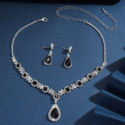 Silver bridal jewelry set with black crystal drop necklace, teardrop pendant, and earrings