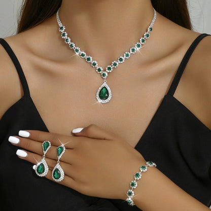 Rhinestone bridal jewelry set: green teardrop necklace, matching earrings and bracelet