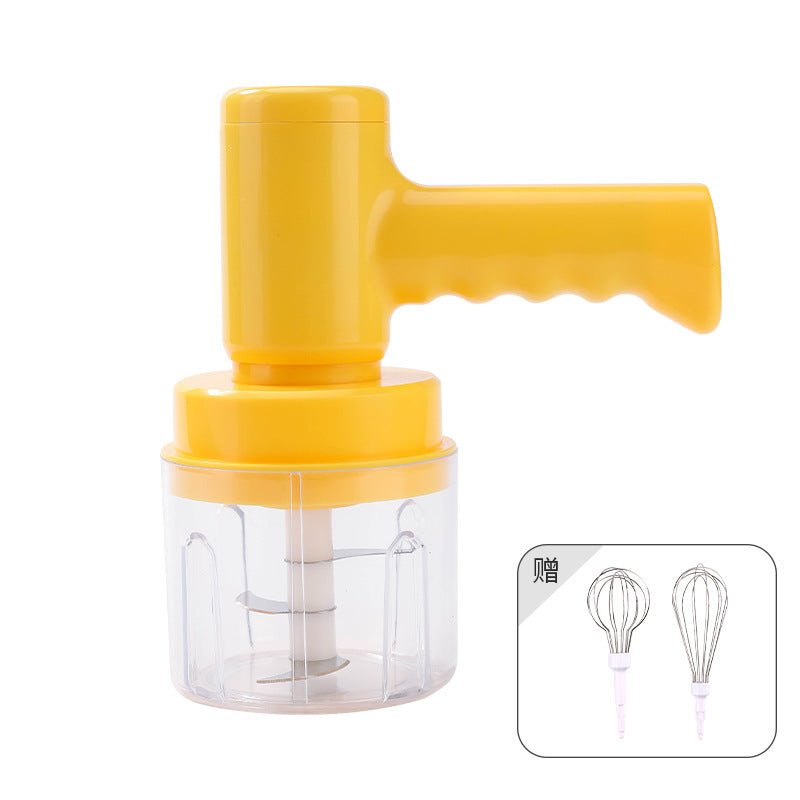 Electric whisk hand blender with yellow motor unit, clear cup, and included wire whisk attachments