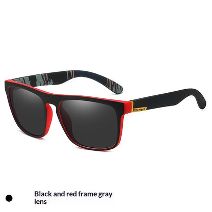 Sunglasses with black and red frame and gray lenses on a white background