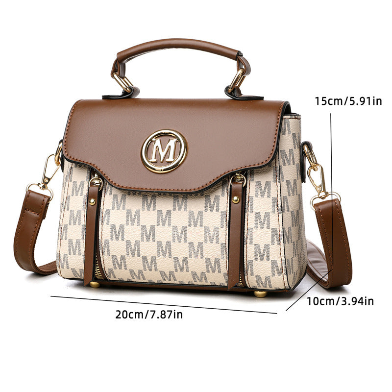Brown and beige handbag with 'M' logo and measurements on a white background
