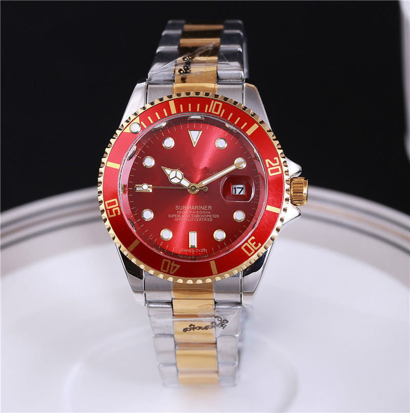 Steel wristwatch with red dial, stainless bracelet, red bezel with gold-tone accents.