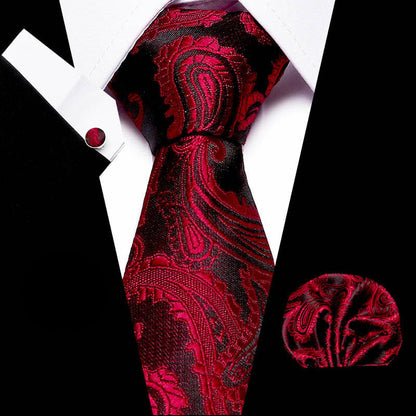 Red paisley tie with matching pocket square on a black and white background