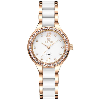 Watch with white and rose gold design on a white background
