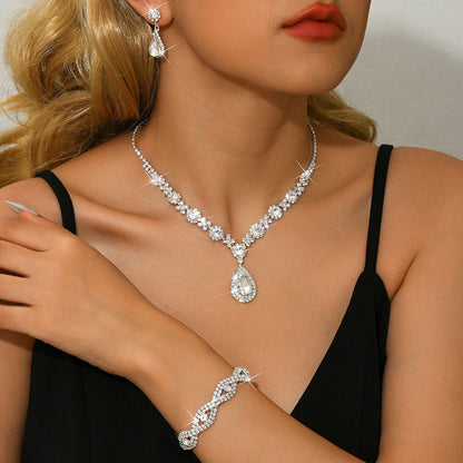 Bridal jewelry set with clear crystal drop necklace, teardrop pendant, and earrings