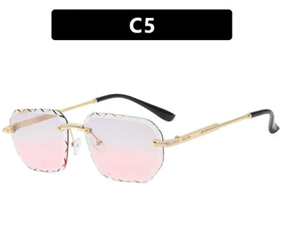Sunglasses with gradient pink lenses and gold frames on a white background