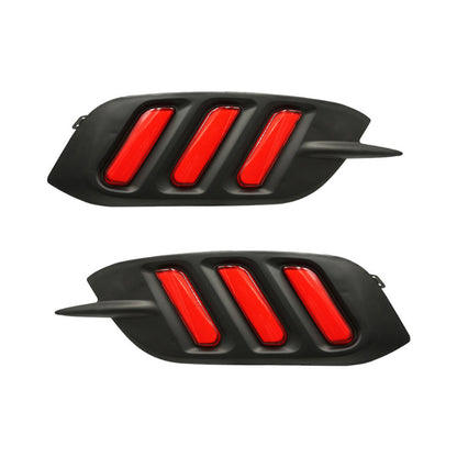 Two black car grille inserts with red accents on a white background