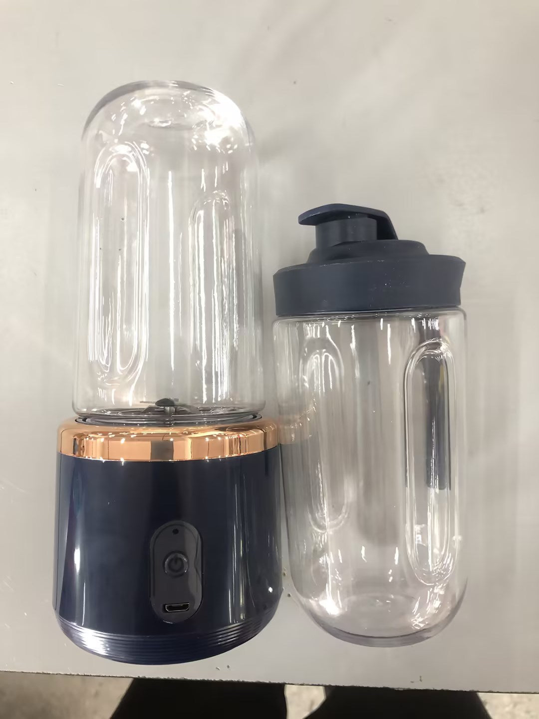 Fruit juice blender with a clear container on a white background