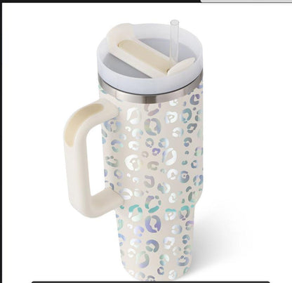 Cream 40 oz tumbler with handle, lid, and clear straw; multicolor leopard-print wrap