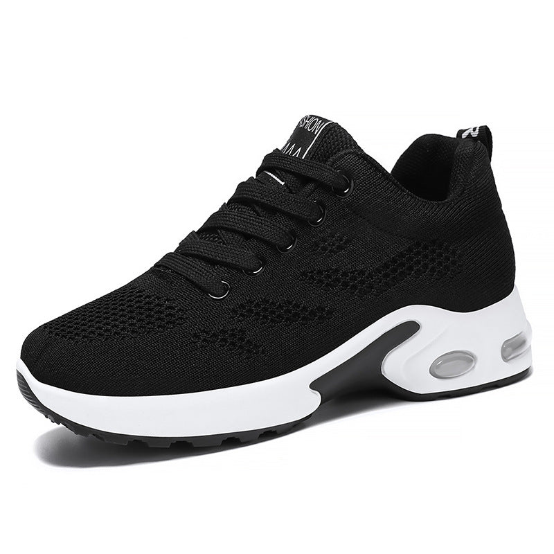 Black sneaker with white sole on a white background