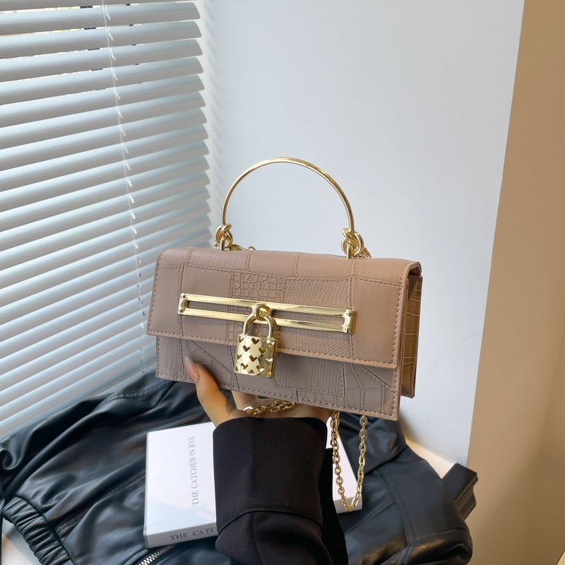 Women’s chain crossbody bag in beige PU leather with gold-tone bar clasp and lock charm