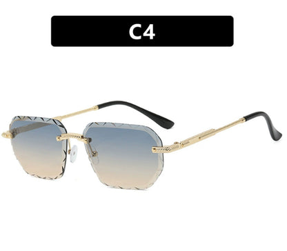 Sunglasses with gold frame and gradient lenses on a white background