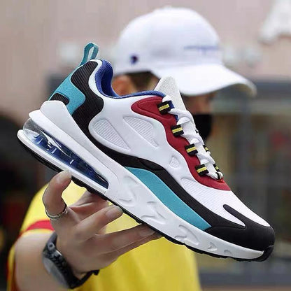 Colorful sneaker held by a person with a blurred background