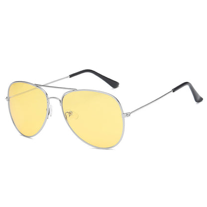 Aviator sunglasses with yellow lenses and silver frames on a white background
