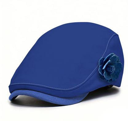 Blue fabric beret with blue flower accent and darker blue brim trim.