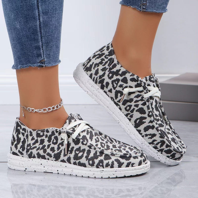 Leopard-print flat knit lace-up shoes with white laces and textured low-profile sole