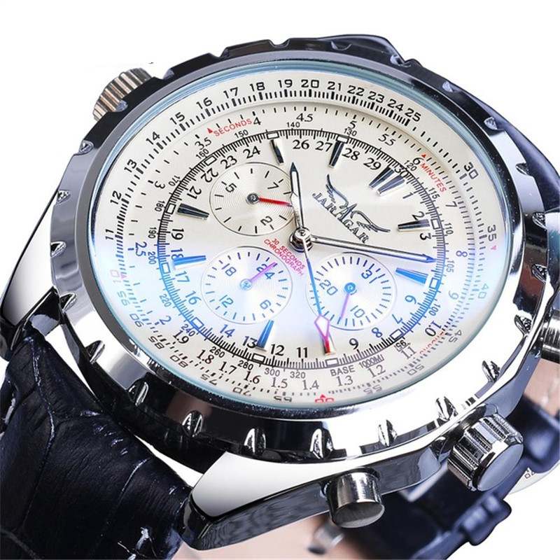 Close-up of a detailed wristwatch with a black leather strap on a white background
