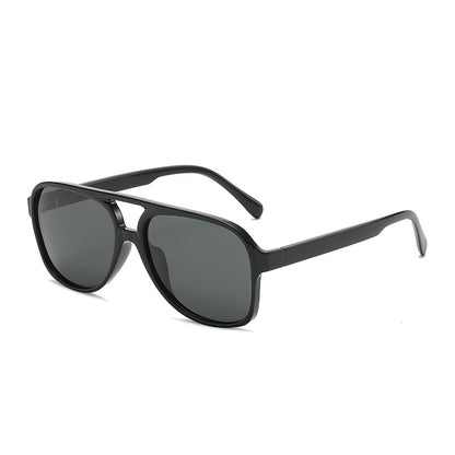 Black sunglasses with dark lenses on a white background