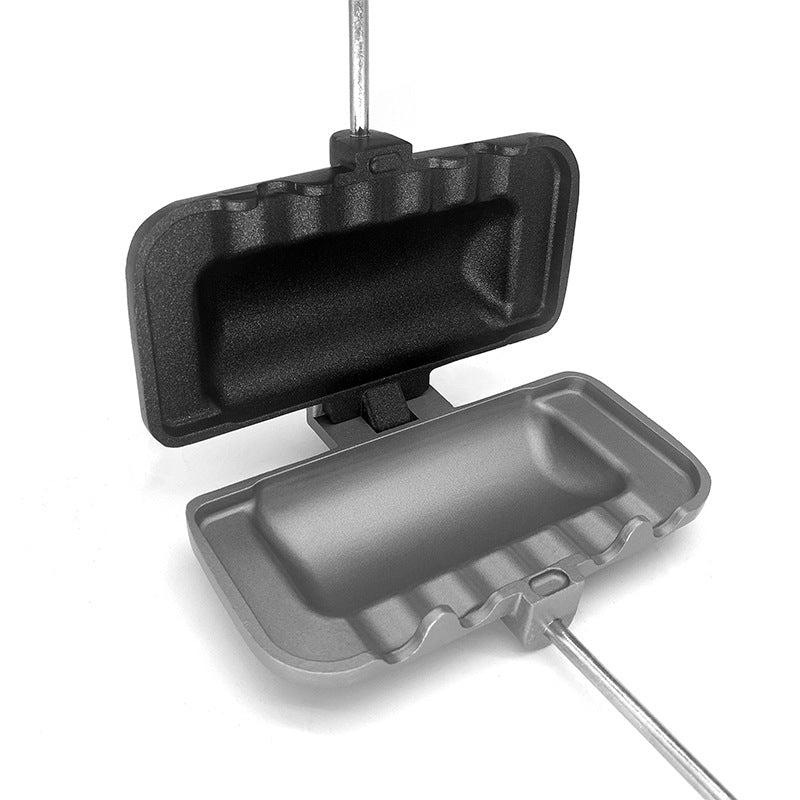 Black and gray waffle maker on a white background