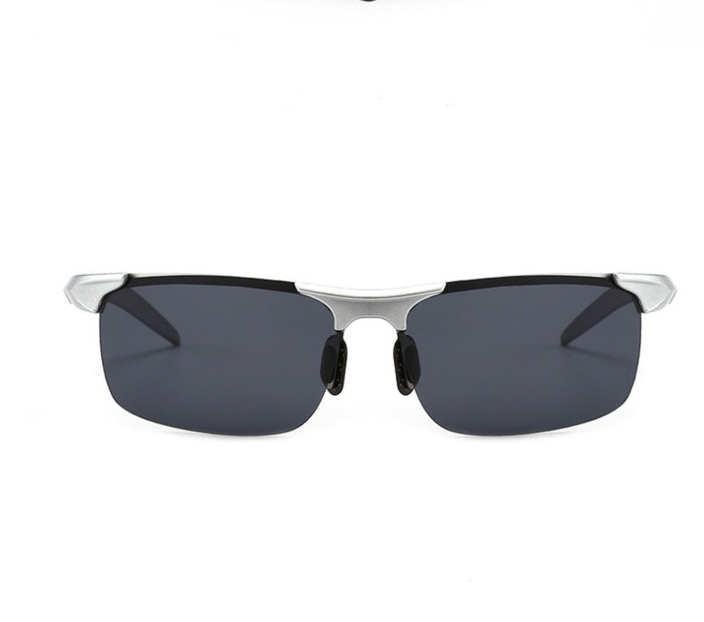 Sunglasses with black lenses and silver frame on a white background