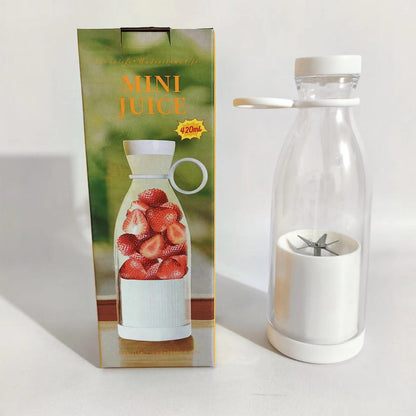 Mini juice blender bottle with white lid and clear cup showing stainless blades